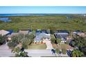 Waterfront property showcasing a house and lush surroundings at 4147 Marine Pkwy, New Port Richey, FL 34652