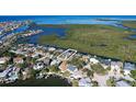 Wide shot of waterfront home and neighborhood at 4147 Marine Pkwy, New Port Richey, FL 34652