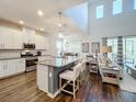 Modern kitchen with white cabinets, granite countertops, and island at 5935 Maidenstone Way, Palmetto, FL 34221