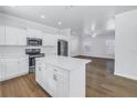Modern open kitchen with stainless steel appliances and island at 1521 Preston S St, St Petersburg, FL 33712