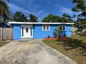 Blue house with a landscaped yard and driveway at 5135 Newton S Ave, Gulfport, FL 33707