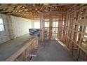 Under construction kitchen with tile backsplash and island at 633 Allora Ave, Nokomis, FL 34275