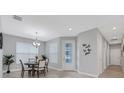 Dining area with a round table and chairs near entryway at 4735 Avila Lakes Dr, Wimauma, FL 33598