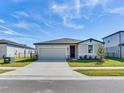 Two-story house with attached garage and manicured lawn at 3146 Forrest Plum Ct, Zephyrhills, FL 33540