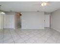 Bright living room with tile floors and neutral walls at 4721 Grove Point Dr, Tampa, FL 33624