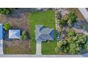 Aerial view showing a new home's location, landscaping, and surrounding neighborhood at 3471 Winona St, Port Charlotte, FL 33948