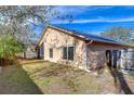 Spacious backyard with grassy area and wooden fence at 2529 Clareside Dr, Valrico, FL 33596