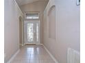 Bright entryway with tiled floor and stained-glass door at 2529 Clareside Dr, Valrico, FL 33596