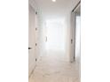 Bright hallway with marble floors and modern doors at 777 3Rd N Ave # 1605, St Petersburg, FL 33701