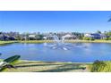 Community lake with fountain, providing a serene backdrop to the homes at 20953 Broadwater Dr, Land O Lakes, FL 34638