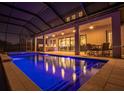 Enclosed pool and spa with covered patio and outdoor seating at 13019 Paddock Wood Pl, Riverview, FL 33579
