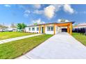 Modern home exterior with driveway and landscaping at 4008 W Leila Ave, Tampa, FL 33616