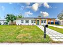 Modern home exterior, freshly landscaped lawn at 4008 W Leila Ave, Tampa, FL 33616