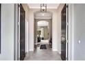 Bright entryway with tile flooring and views into the living areas at 15304 Serengeti Blvd, Spring Hill, FL 34610