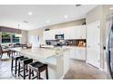 Spacious kitchen with white cabinets, granite counters, and island at 15304 Serengeti Blvd, Spring Hill, FL 34610