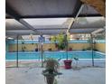 Inviting screened pool with surrounding patio at 6117 Adamsville Rd, Gibsonton, FL 33534