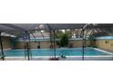 Screened-in rectangular swimming pool at 6117 Adamsville Rd, Gibsonton, FL 33534