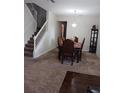 Formal dining room with dark wood furniture and carpeting at 10319 Boyette Creek Blvd, Riverview, FL 33569