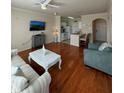 Living room with hardwood floors and open kitchen at 1216 S Missouri Ave # 317, Clearwater, FL 33756