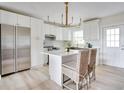 Bright kitchen with stainless steel appliances and white cabinets at 1948 Jeffords St, Clearwater, FL 33764