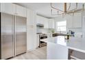 Modern kitchen featuring stainless steel appliances and white cabinetry at 1948 Jeffords St, Clearwater, FL 33764