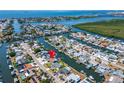 Aerial view of waterfront community with winding canals and easy Gulf access at 1011 Spindle Palm Way, Apollo Beach, FL 33572