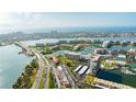 Aerial view showing waterfront property, bridge, and surrounding city at 7400 Sun Island Dr # 501, South Pasadena, FL 33707