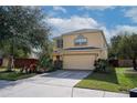 Charming two-story home with a two-car garage, driveway, and a well-maintained lawn and garden at 9703 33Rd E Ave, Palmetto, FL 34221