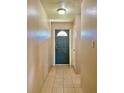 Bright hallway with tile floors and interior door at 1001 N Park Rd, Plant City, FL 33563