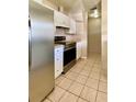 Kitchen with stainless steel appliances and white cabinets at 1001 N Park Rd, Plant City, FL 33563
