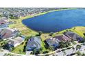 Community overview showing a lakefront property and surrounding homes at 11521 Lake Lucaya Dr, Riverview, FL 33579