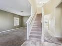 Elegant staircase leading to the upper level of the home at 526 19Th Nw St, Ruskin, FL 33570