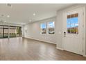 Bright and spacious living room with tile flooring and large windows at 12310 Hearts Ease St, Venice, FL 34293