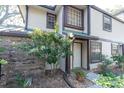 Townhouse entryway with white door and brick accents at 1510 Mahogany Ln # 606, Palm Harbor, FL 34683