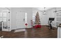 Spacious entryway with Christmas tree and exercise bike at 16347 Mellon Rd, Weeki Wachee, FL 34614