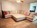Spacious living room featuring a large sectional sofa at 8823 W Robson St, Tampa, FL 33615