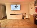 Living room with mounted TV and ample floor space at 8823 W Robson St, Tampa, FL 33615