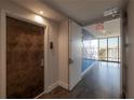 Residential hallway with tiled floors and an exit at 199 Dali Blvd # 1101, St Petersburg, FL 33701