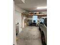 Garage with overhead storage, workbench, and room for a vehicle at 844 Callista Cay Loop, Tarpon Springs, FL 34689