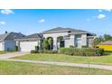 One story house with a two car garage, well manicured lawn, and beautiful landscaping at 510 Tuscanny St, Brandon, FL 33511