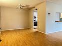 Bright dining room with light wood flooring and access to the kitchen at 122 Loblolly Ct # B, Oldsmar, FL 34677