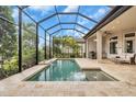 Relaxing pool area complete with screened-in enclosure and plenty of room for entertaining at 4825 Benito Ct, Bradenton, FL 34211