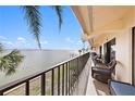 Relaxing balcony with water views and wicker chairs at 7540 Sunshine Skyway S Ln # 220, St Petersburg, FL 33711