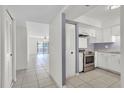 Bright kitchen with stainless steel appliances and white cabinets at 3714 Greenery Ct # 214, Tampa, FL 33618