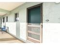 A unit entrance showing front door with screen, and the unit number '511' at 801 83Rd N Ave # 511, St Petersburg, FL 33702