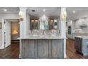 Modern kitchen with granite countertops and custom cabinetry at 418 Cardiff Rd, Venice, FL 34293