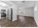 Modern kitchen, stainless steel appliances, and dark wood flooring at 10206 Lola St, Tampa, FL 33612