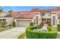 Attractive two-story home with tile roof and landscaped grounds at 3076 Braeloch E Cir # 5, Clearwater, FL 33761