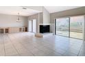 Bright living room with fireplace and sliding glass doors at 3076 Braeloch E Cir # 5, Clearwater, FL 33761