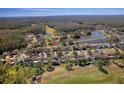 Residential home nestled in a community by a golf course and lake at 12818 Royal George Ave, Odessa, FL 33556
